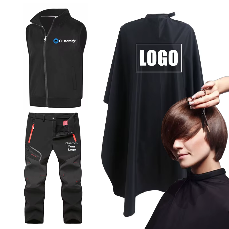 Ein vielseitiges Sortiment an personalisierter Berufsbekleidung bestehend aus einer schwarzen Softshell-Arbeitsweste, einer Arbeitshose und einem Friseurumhang aus Polyester mit Logo-Aufdruck auf weissem Hintergrund.