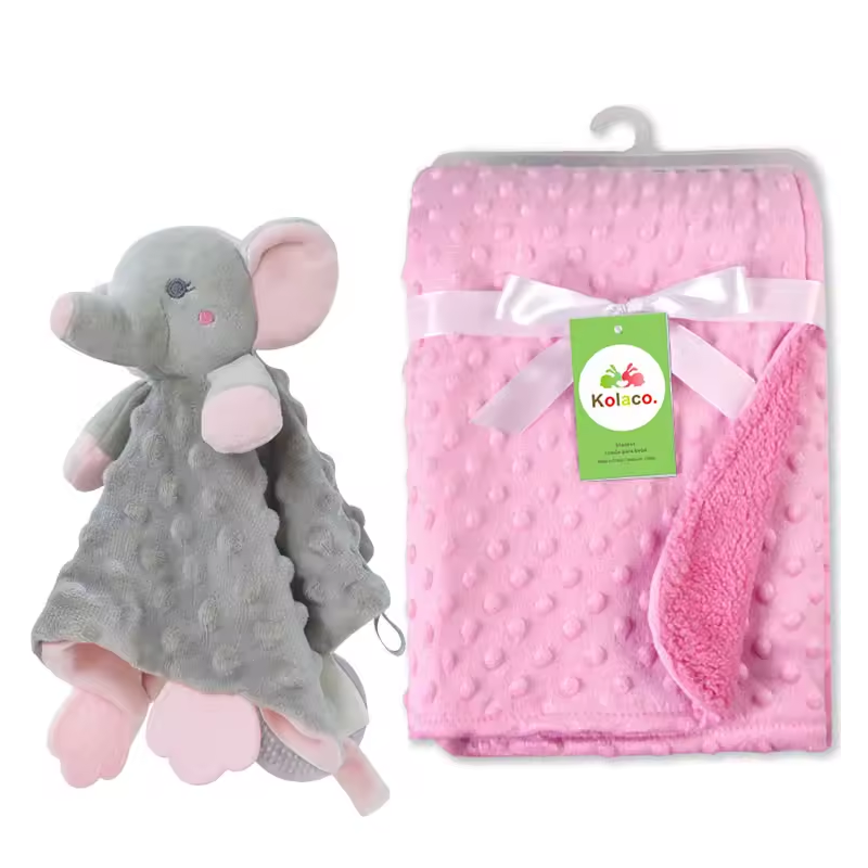 Rosa Babydecke aus Noppenstoff mit weisser Schleife und passendes graues Elefanten-Nuscheli Schmusetuch als personalisierbares Geburtsgeschenk.